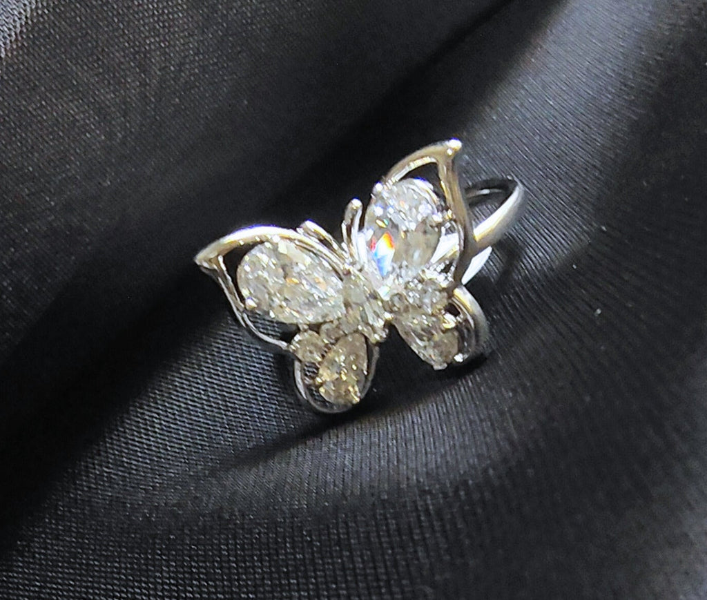 Butterfly-shaped ring with clear gemstones 